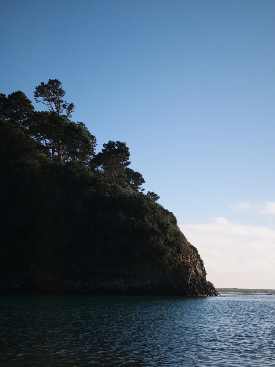 The headland and the sea at dusk
