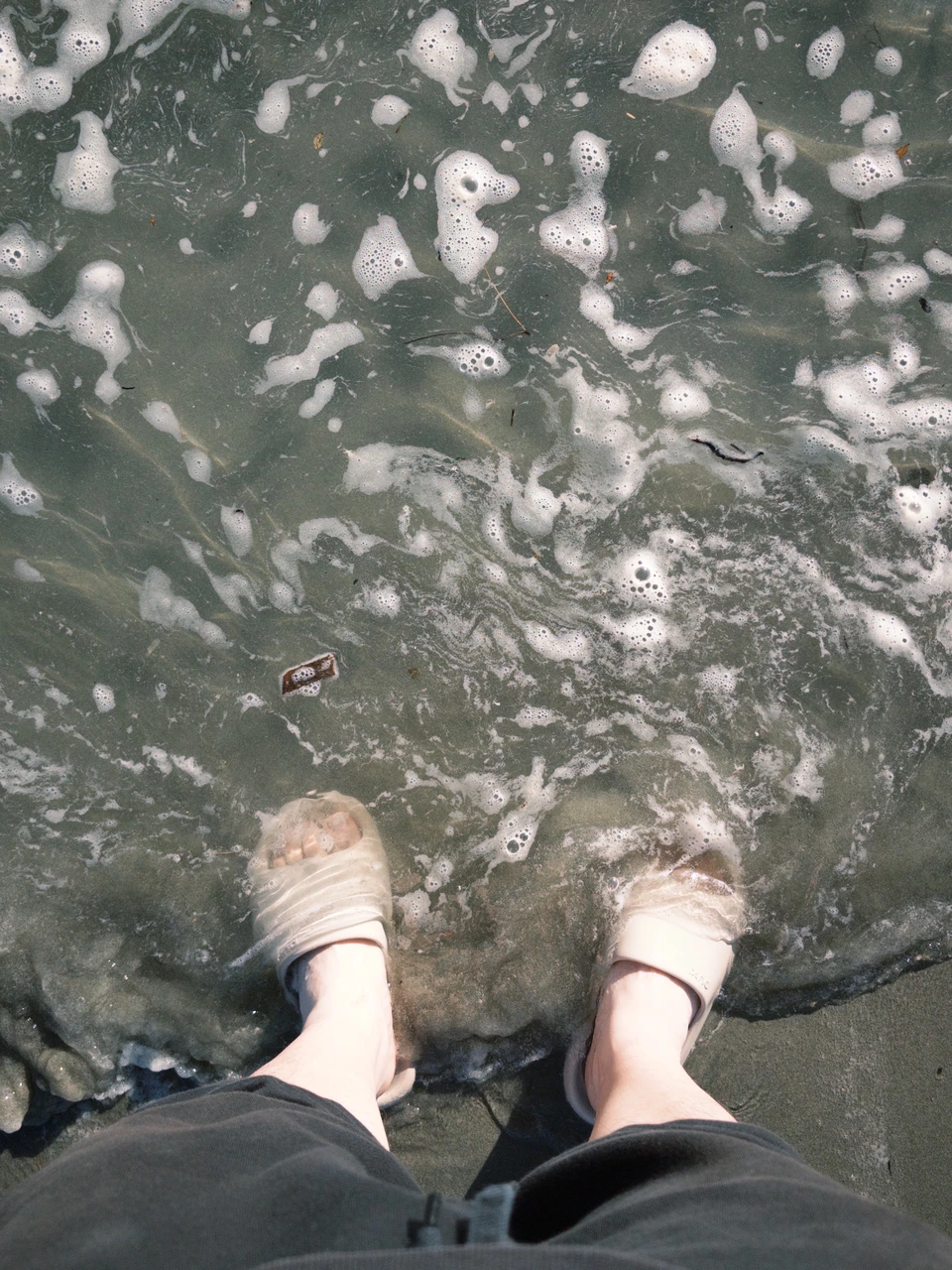 Bare feet in the shallow water