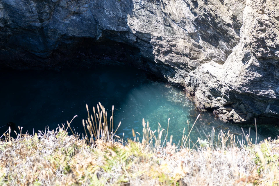 Green water inside a sea cave