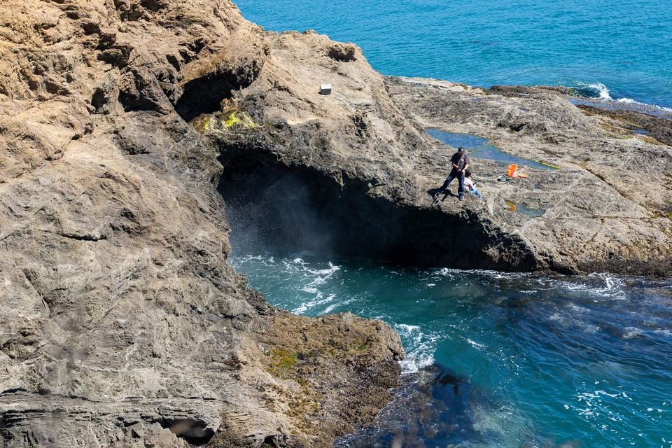 People beside a blowhole